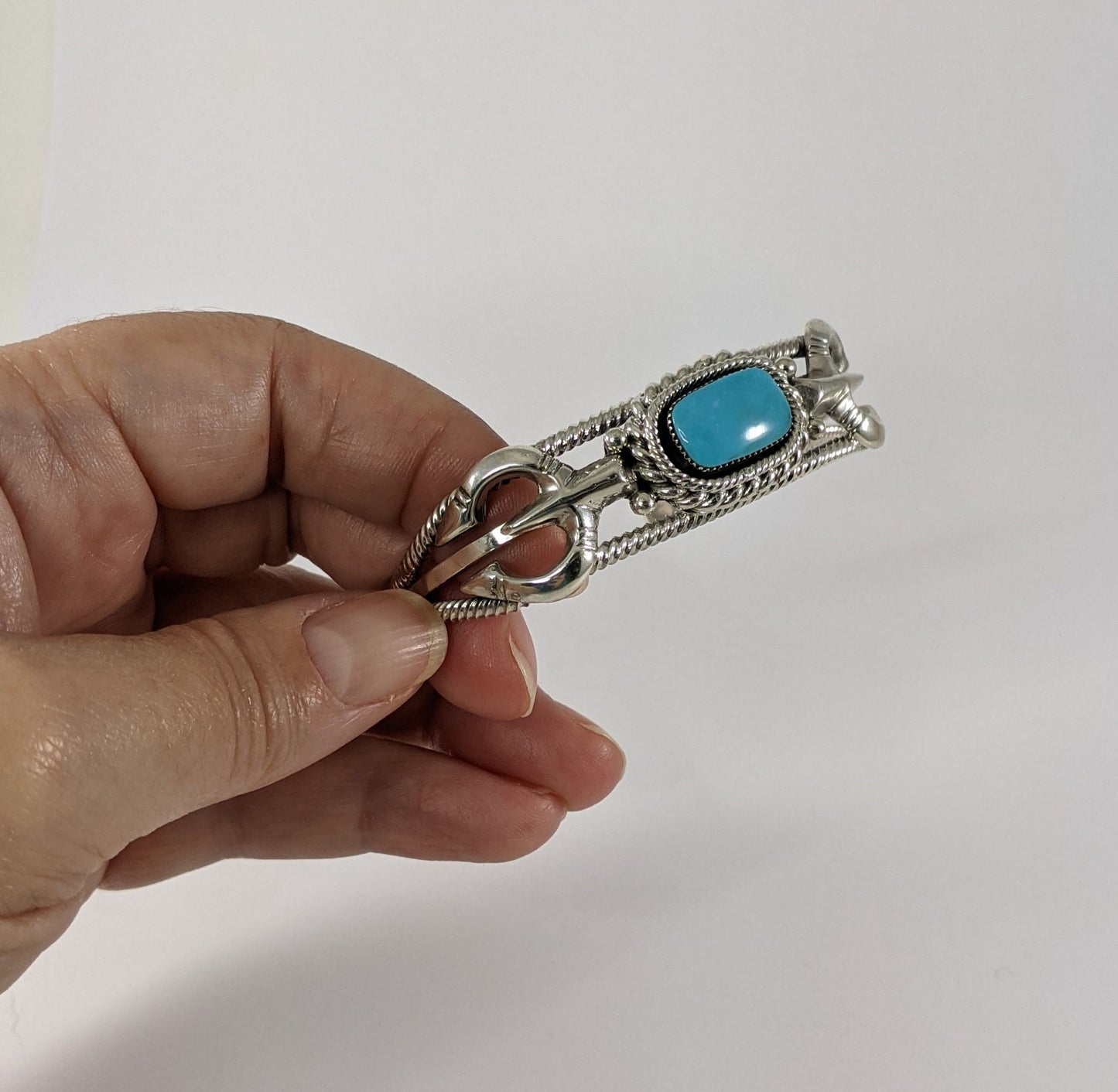 Sterling Silver and Turquoise Cuff Bracelet with Traditional Naja Design and Rope Detail, Signed Running Bear