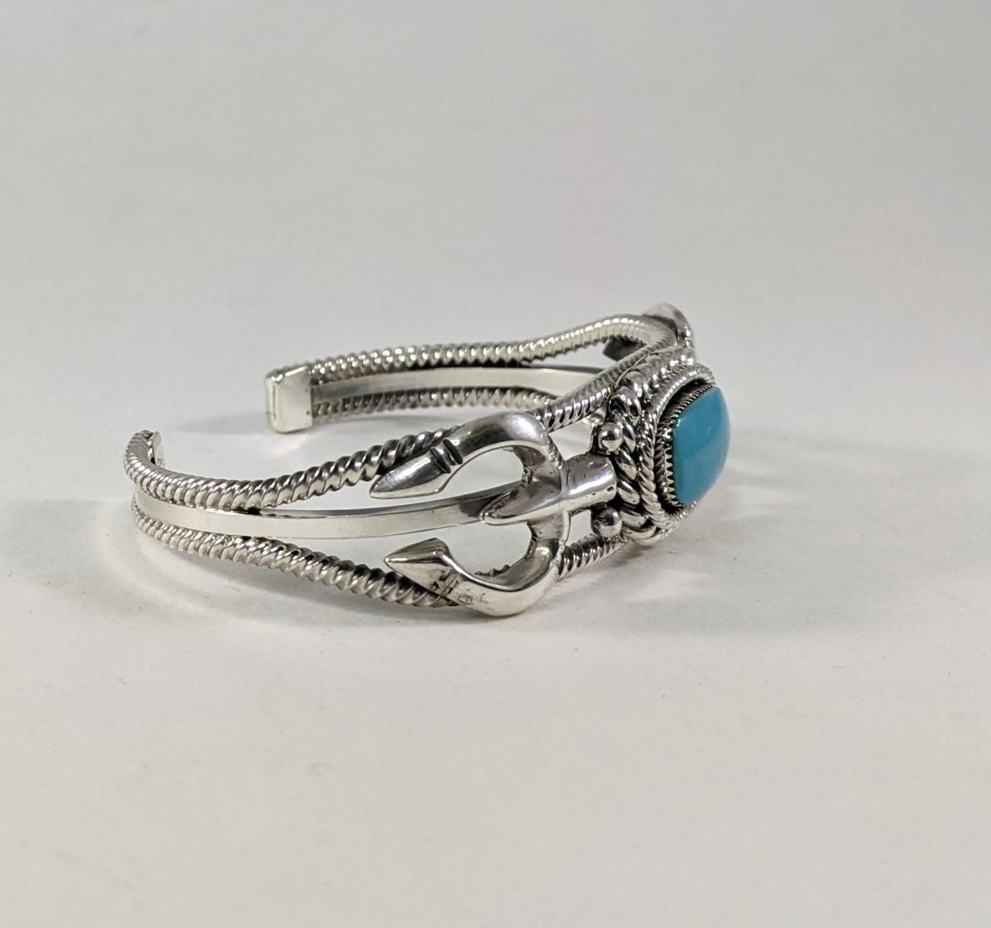 Sterling Silver and Turquoise Cuff Bracelet with Traditional Naja Design and Rope Detail, Signed Running Bear