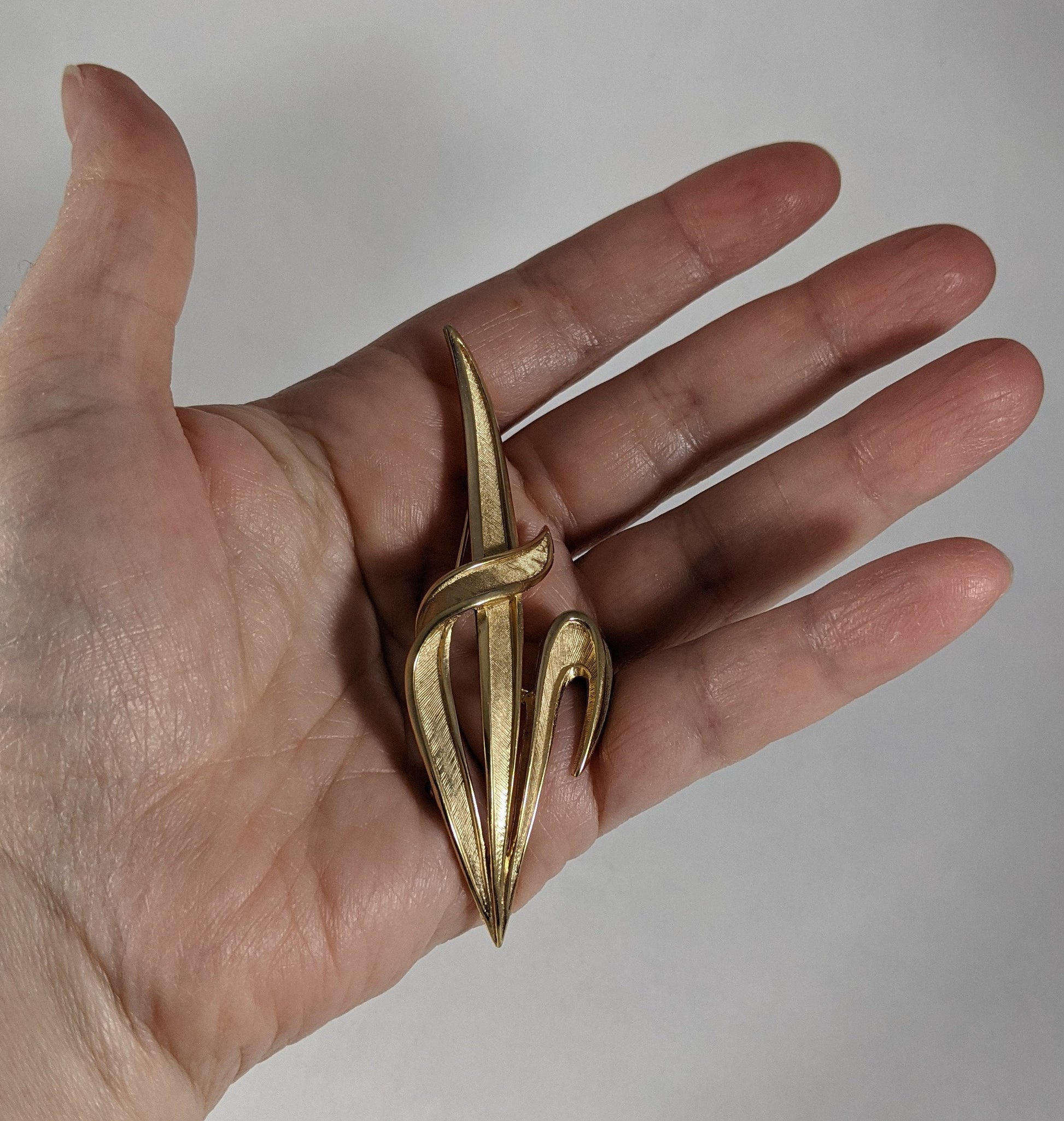 Trifari statement brooch, signed gold tone costume jewelry, vintage 1960s designer leaf pin, elegant scarf or jacket accessory