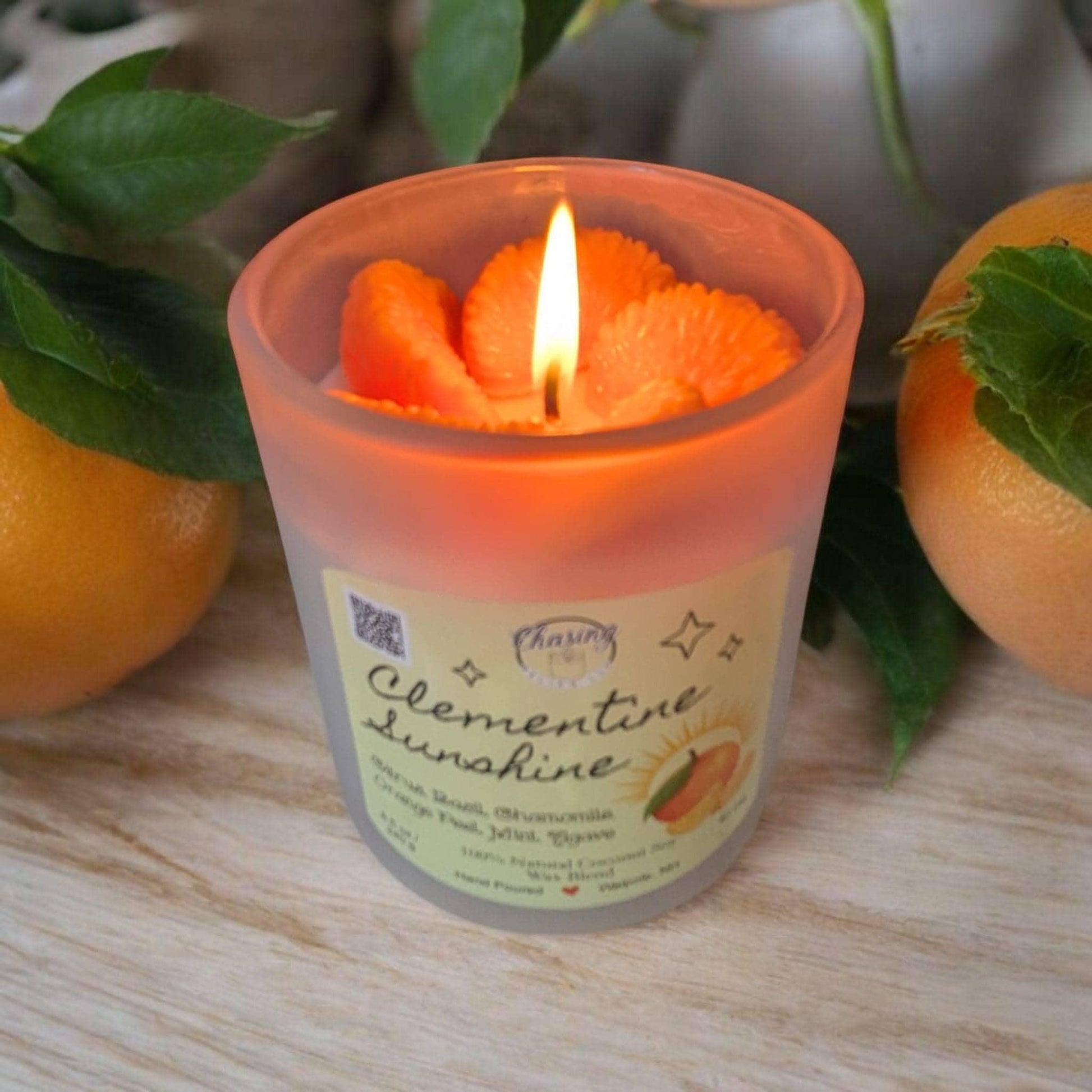 Hand-poured Clementine Sunshine candle with citrus slice wax top, made from 100% natural coconut soy wax.