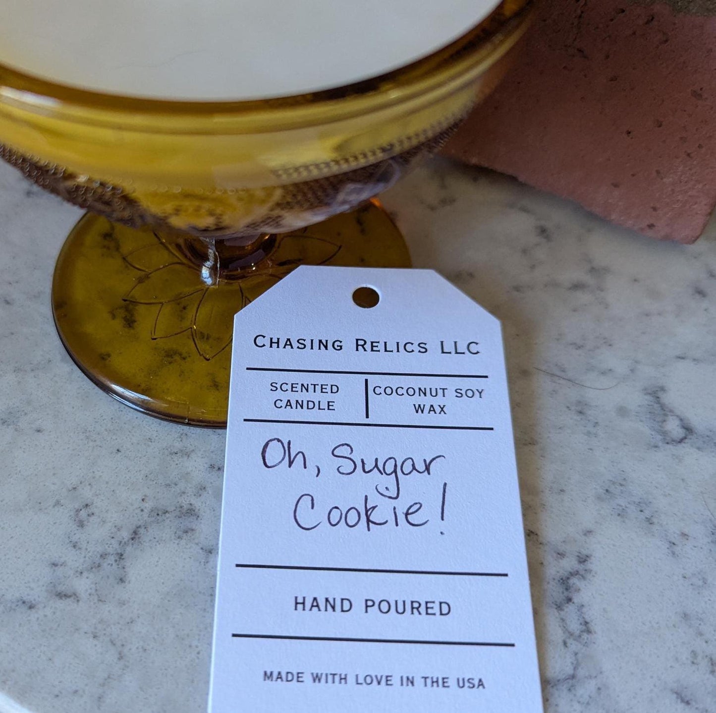 Hand-poured vintage glass candle with coco-soy wax blend, 'Oh, Sugar Cookie!' scent, amber Tiara design, 4oz.